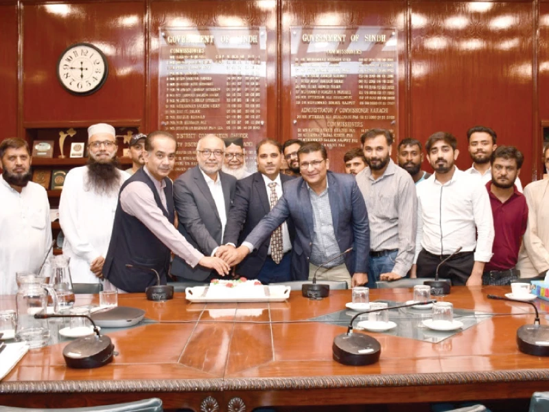 additional commissioner karachi ghulam mehdi shah and commissioner xi skipper ahmer pasha cut a cake to celebrate victory in hanif mohammad cup festival match as team members and other officials look on photo app additional commissioner karachi ghulam mehdi shah and commissioner xi skipper ahmer pasha cut a cake to celebrate victory in hanif mohammad cup festival match as team members and other officials look on photo app