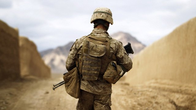 a us marine from the first battalion eighth marines alpha company patrols through the town of nabuk in southern afghanistan 039 s helmand province february 18 2011 photo reuters