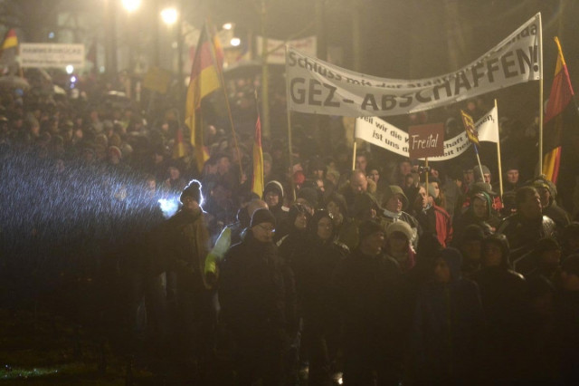 demonstrators take part in a rally by a mounting right wing populist movement on january 5 2015 in dresden eastern germany photo afp demonstrators take part in a rally by a mounting right wing populist movement on january 5 2015 in dresden eastern germany photo afp