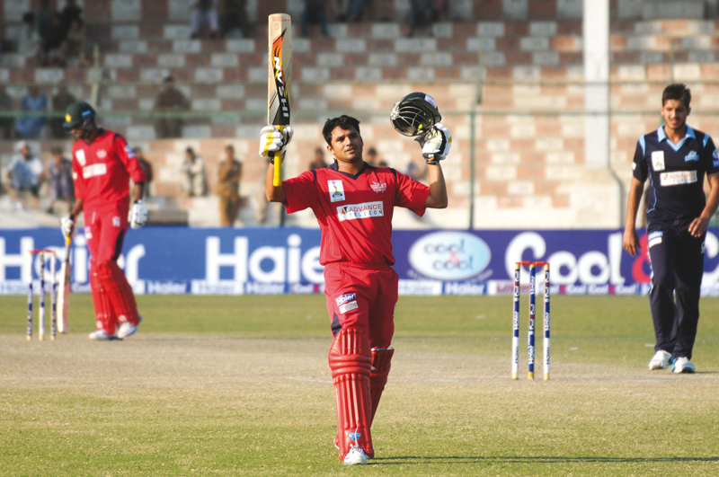 azhar ali raises his bat after reaching his century for the warriors photo mohammad azeem express