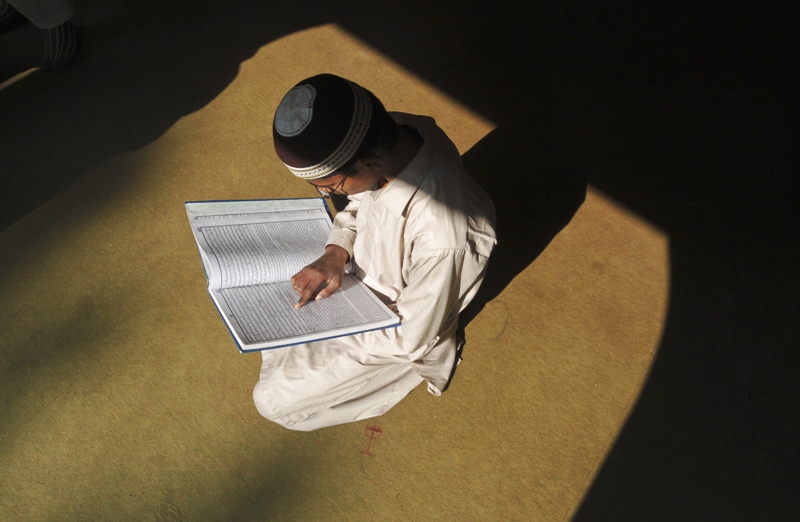 a file photo of a young boy reading inside a madrassa photo reuters