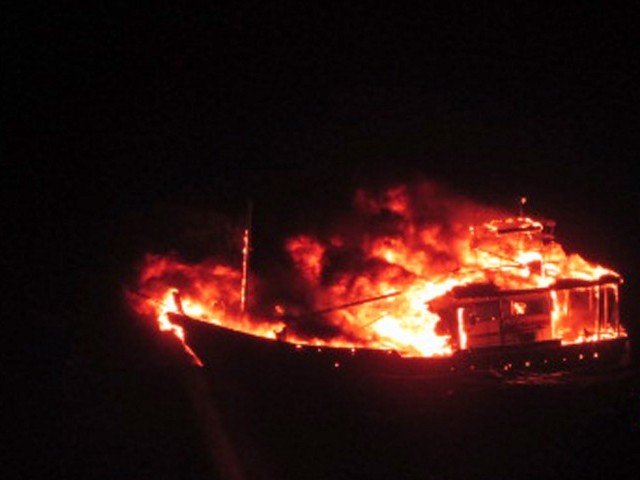 this handout photograph released by the indian ministry of defence on january 2 2015 is said to show a burning vessel off the coast of the western indian state of gujarat in the arabian sea early on january 1 2015 photo afp