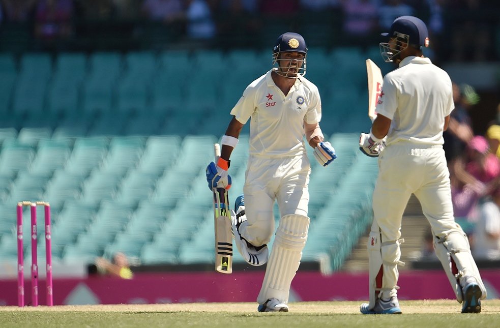 batsman lokesh rahul c celebrates his century with batting partner virat kohli r during day three of the fourth cricket test between australia and india at the sydney cricket ground scg on january 8 2015 photo afp