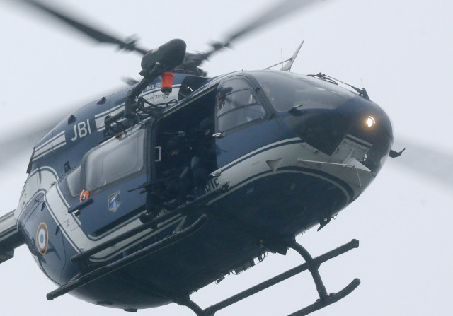 a french army helicopter with intervention forces hovers near the scene of a hostage taking at an industrial zone in dammartin en goele northeast of paris january 9 2015 photo afp a french army helicopter with intervention forces hovers near the scene of a hostage taking at an industrial zone in dammartin en goele northeast of paris january 9 2015 photo afp