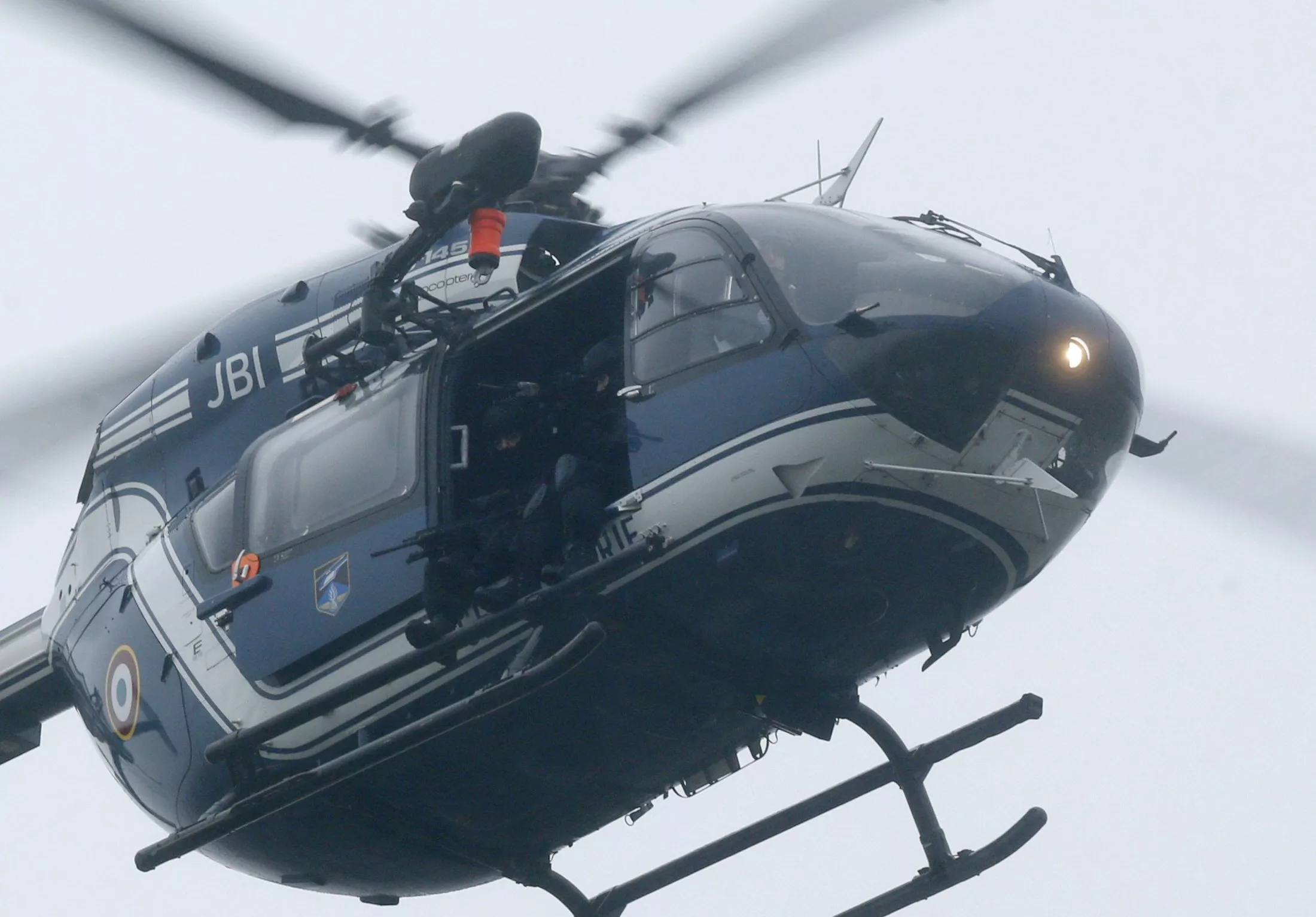 a french army helicopter with intervention forces hovers near the scene of a hostage taking at an industrial zone in dammartin en goele northeast of paris january 9 2015 photo afp a french army helicopter with intervention forces hovers near the scene of a hostage taking at an industrial zone in dammartin en goele northeast of paris january 9 2015 photo afp