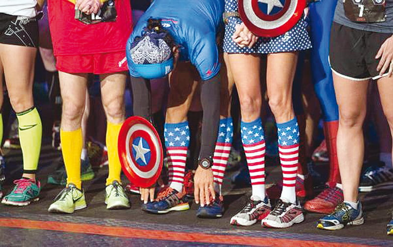 runners in super hero outfits prepare at the start of the avengers super heroes half marathon in and around the disney parks photo reuters