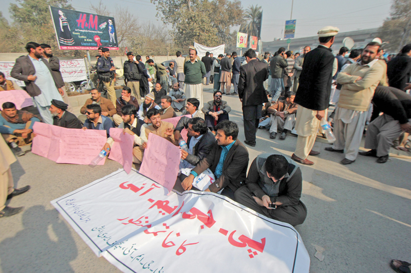 doctors shout slogans outside the k p assembly against the health care commission bill 2015 photo muhammad iqbal express