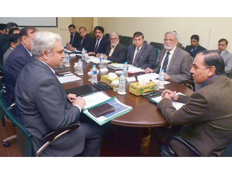 nab chairman qamar zaman chaudhry is briefed about the performance of the bureau s lahore chapter photo pr