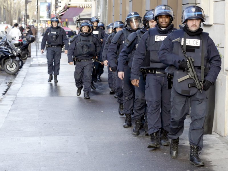 riot police patrol in paris as part of the highest level of security plan photo afp