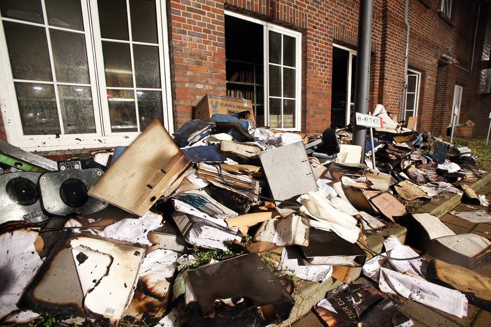 burnt and damaged files are seen in the courtyard of german regional newspaper hamburger morgenpost editorial office in hamburg northern germany on january 11 2015 after an arson attack photo afp