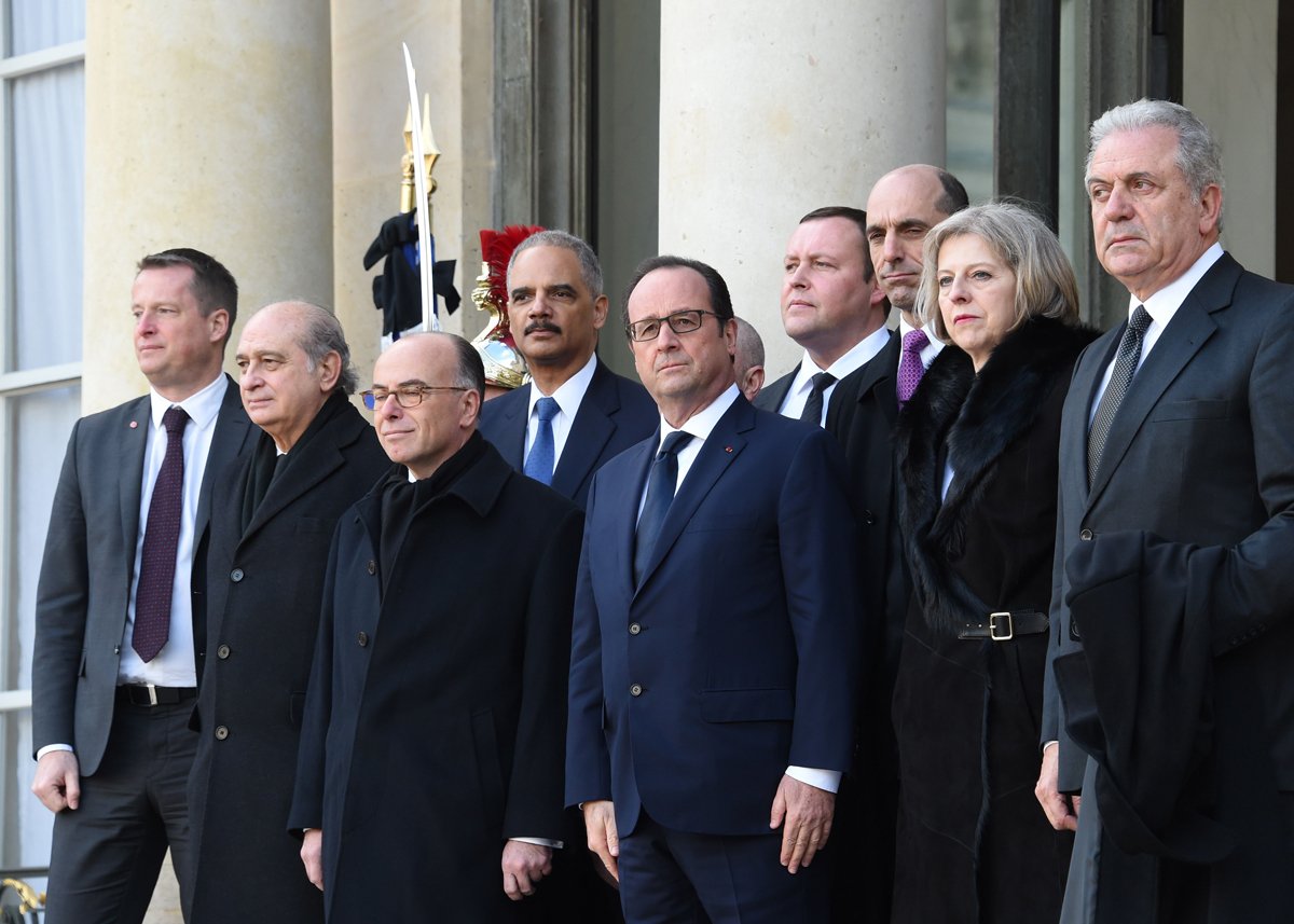 french president francois hollande french interior minister bernard cazeneuve welcome us attorney general eric holder and canadian public safety minister steven blaney at the elysee palace before attending a unity rally marche republicaine on january 11 2015 in paris photo afp