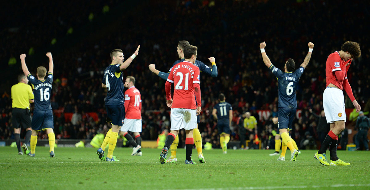 southampton players celebrate as manchester united recact as the final whistle is blown during the english premier league football match between manchester united and southampton at old trafford in manchester photo afp