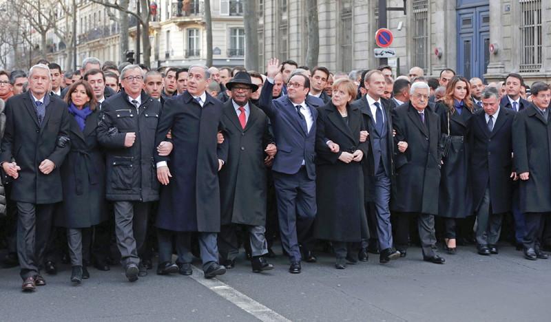 french president francois hollande is surrounded by heads of state as they attend the solidarity march in the streets of paris photo reuters
