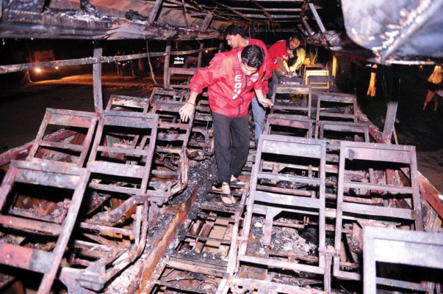 volunteers sift through the wreckage of the passenger bus photo afp volunteers sift through the wreckage of the passenger bus photo afp