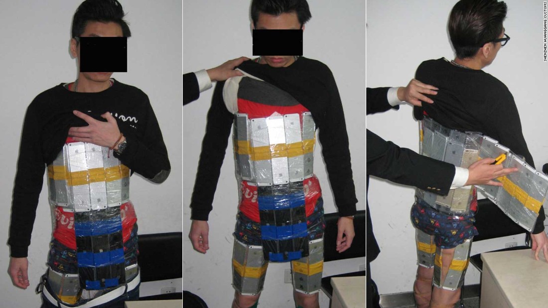 customs authorities show dozens of neatly shrink wrapped shiny iphones strapped around the man 039 s body photo china custom authorities