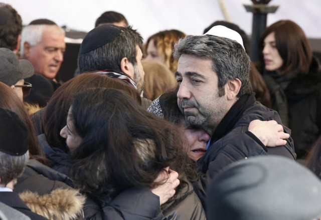 israeli mourners hug before the funeral in jerusalem on january 13 2015 of four french jews killed in an attack on a kosher supermarket in paris last week photo afp israeli mourners hug before the funeral in jerusalem on january 13 2015 of four french jews killed in an attack on a kosher supermarket in paris last week photo afp