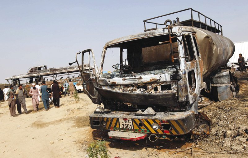 the owner of the tanker above that rammed into the passenger bus seen in the background was traced on tuesday the accident on national highway claimed 62 lives photo file