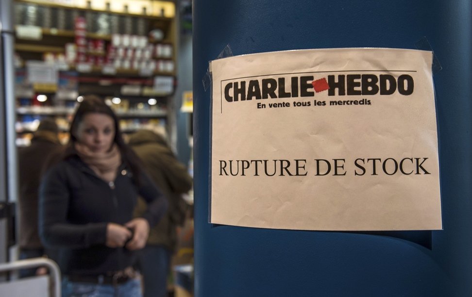 a sign which translates as quot charlie hebdo   sold out quot is displayed outside a newsagents in dunkirk france on january 14 2015 as the latest edition of the french satirical weekly goes on sale photo afp