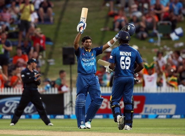 dilshan scored 116 as the visitors comfortably overhauled new zealand 039 s first innings total of 248 photo afp