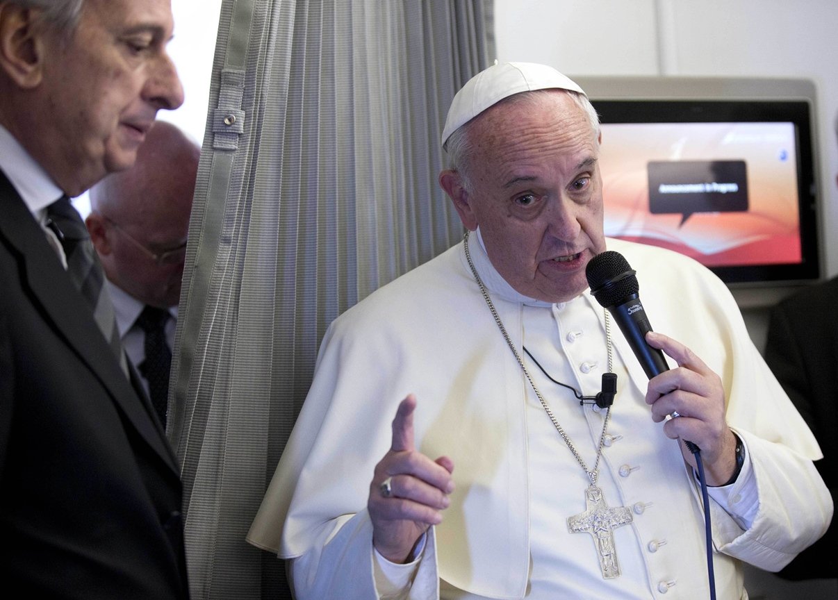 pope francis speaks to the press aboard a plane during his trip to the philippines on january 15 2015 photo afp