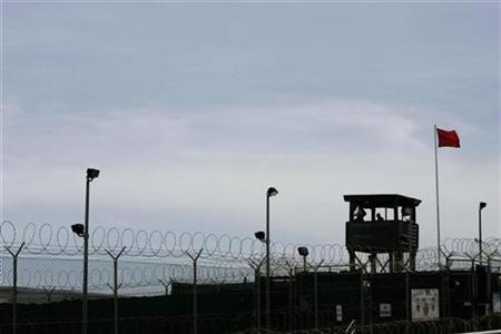 the transfer of the five men leaves 122 inmates at the remote prison located at a us naval base in southeastern cuba photo reuters