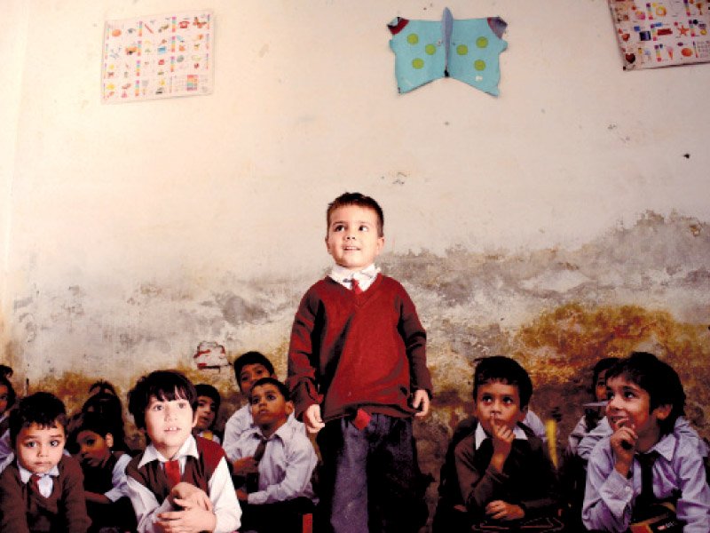 rise and shine gulnawaz repeats his abc s after his teacher in a school on the outskirts of lahore