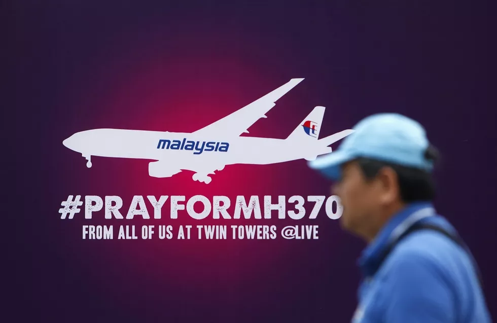 a tourist walks past a signboard saying quot pray for mh370 quot in front of the kuala lumpur city center klcc march 14 2014 photo reuters a tourist walks past a signboard saying quot pray for mh370 quot in front of the kuala lumpur city center klcc march 14 2014 photo reuters
