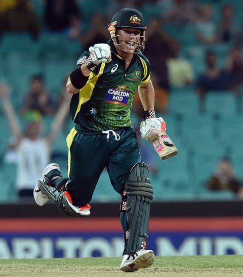 long overdue warner celebrates hitting his third odi century after a dry spell since 2012 in 115 balls which included 18 fours to take australia near the target photo afp