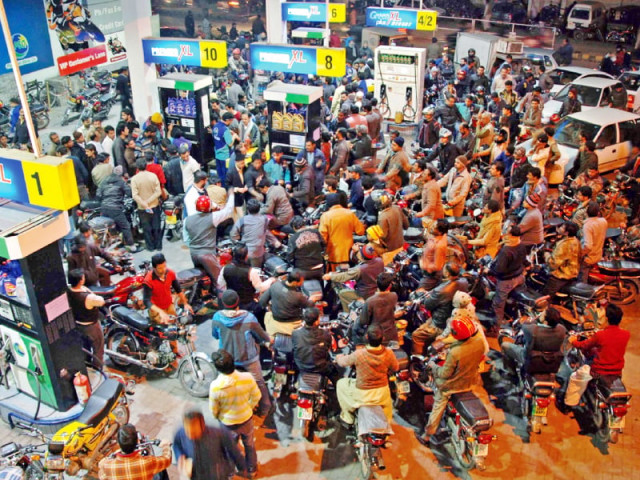 customers throng a filling station in lahore amid severe dearth of petrol photo shahbaz malik express