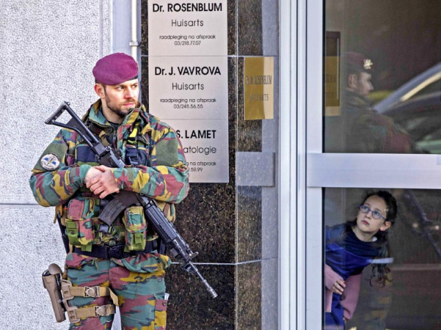 a belgian paratrooper keeps guard outside a private building in the jewish area in antwerp photo reuters