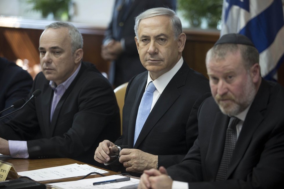 israeli prime minister benjamin netanyahu c chairs the weekly cabinet meeting in jerusalem january 18 2015 israel is lobbying member states of the international criminal court to cut funding for the icc in response to its launch of an inquiry into possible war crimes in the palestinian territories photo afp