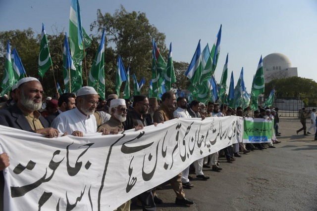supporters of jammat e islami participate in a protest against the printing of sacrilegious material by french magazine charlie hebdo in karachi on january 18 2014 photo afp supporters of jammat e islami participate in a protest against the printing of sacrilegious material by french magazine charlie hebdo in karachi on january 18 2014 photo afp