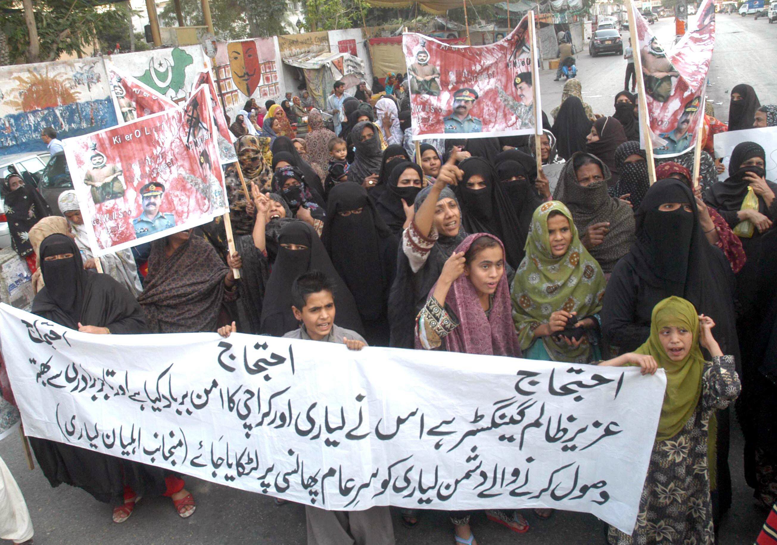 scores of women and children staged two separate protests outside karachi press club carrying placards and photographs of their missing loved ones photo irfan ali express