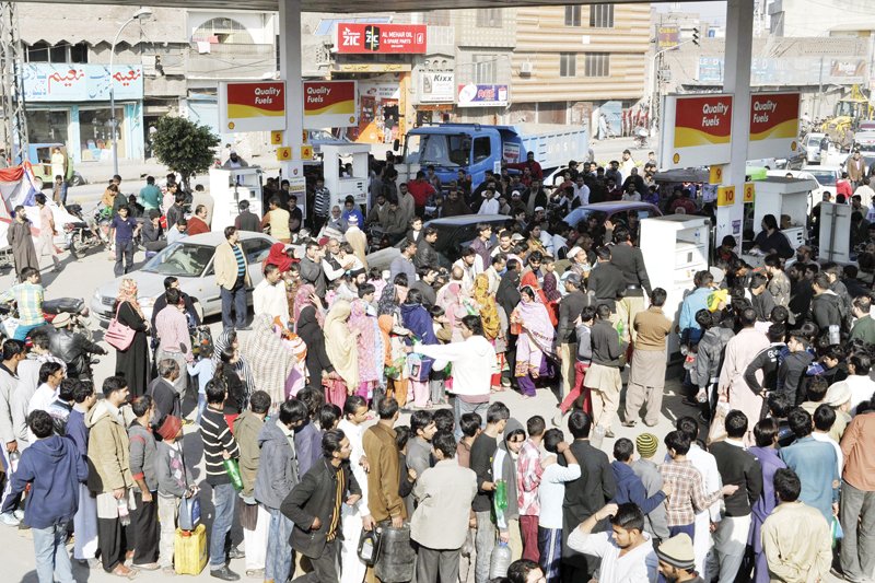 hundreds queued at a petrol station on outfall road photo shafiq malik express