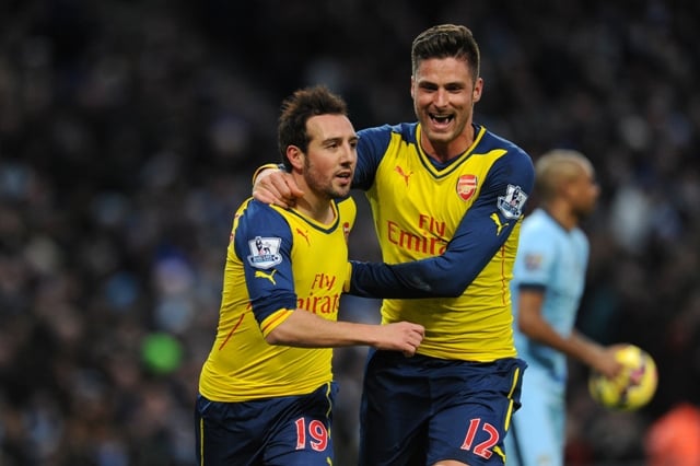 causing an upset giroud celebrates arsenal s opener with scorer cazorla who later set up the frenchman for the second photo afp