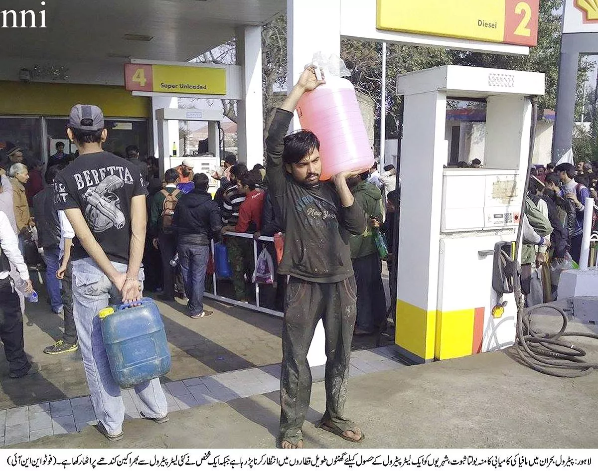 a man carries a container full of petrol at a pumping station in lahore on monday photo nni a man carries a container full of petrol at a pumping station in lahore on monday photo nni
