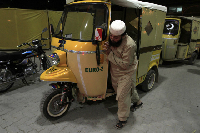 a man pushes his rickshaw to get fuel at a fuel station in rawalpindi january 19 2015 photo reuters a man pushes his rickshaw to get fuel at a fuel station in rawalpindi january 19 2015 photo reuters