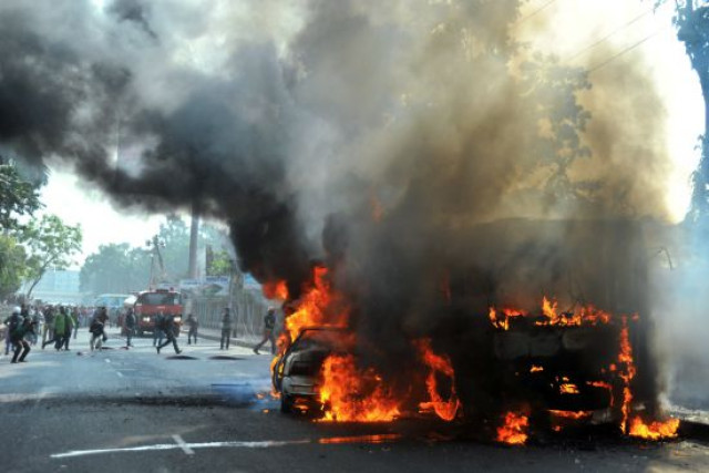 burning vehicles set on fire by opposition demonstrators are pictured during violent protests in dhaka bangladesh on jan 6 2015 photo afp burning vehicles set on fire by opposition demonstrators are pictured during violent protests in dhaka bangladesh on jan 6 2015 photo afp