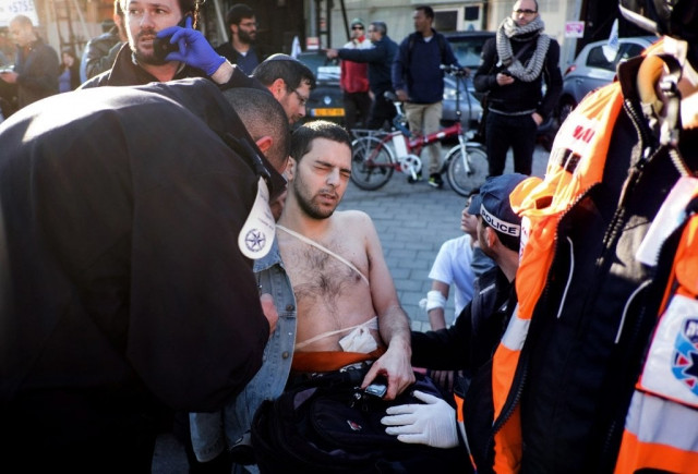 an israeli man is treated by medics after he was stabbed by a palestinian who wounded at least five passengers in a stabbing rampage on a tel aviv bus on january 21 2015 photo afp an israeli man is treated by medics after he was stabbed by a palestinian who wounded at least five passengers in a stabbing rampage on a tel aviv bus on january 21 2015 photo afp
