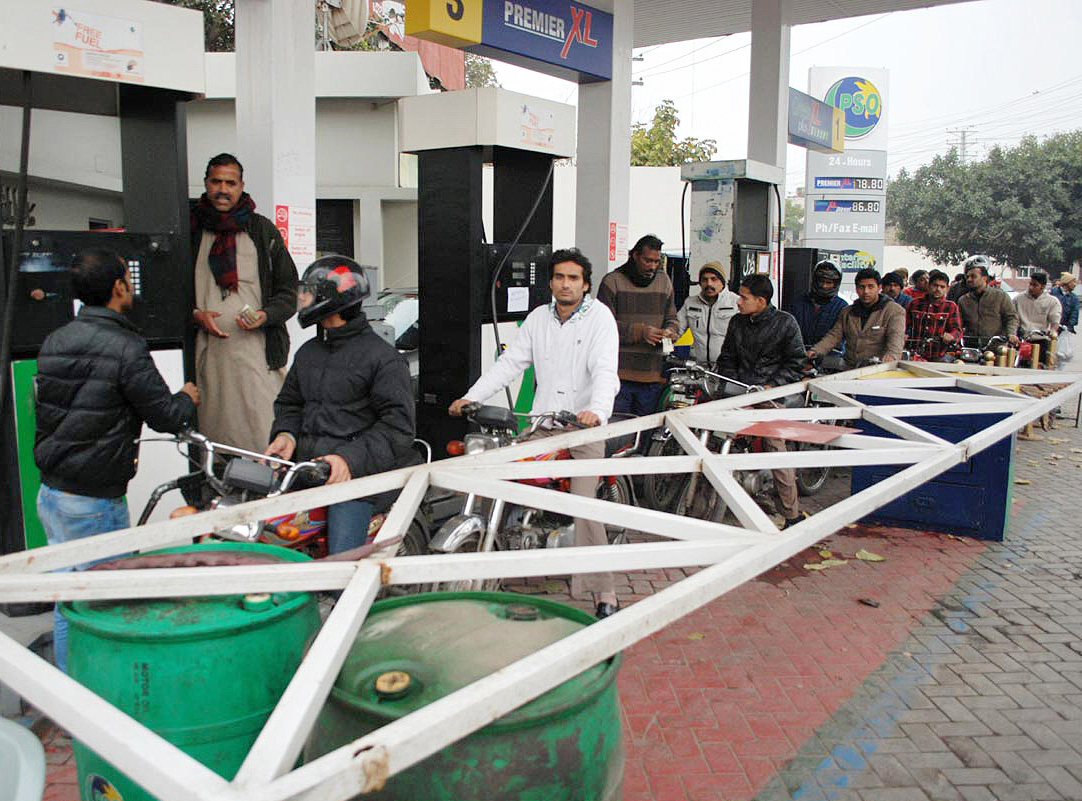 people standing in queue to get petrol in lahore on wednesday photo nni