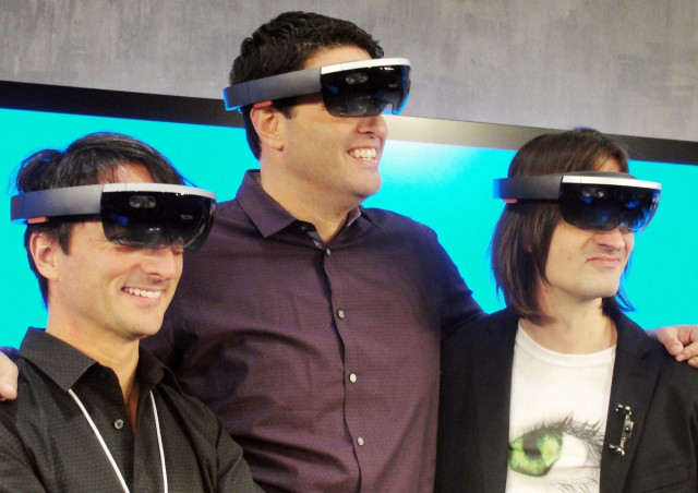 microsoft executives l r joe belfiore terry myerson and alex kipman pose with the hololens eyewear that overlays 3d images on the real world at a press event at the technology titan 039 s main campus in redmond washington on january 21 2015 photo afp microsoft executives l r joe belfiore terry myerson and alex kipman pose with the hololens eyewear that overlays 3d images on the real world at a press event at the technology titan 039 s main campus in redmond washington on january 21 2015 photo afp