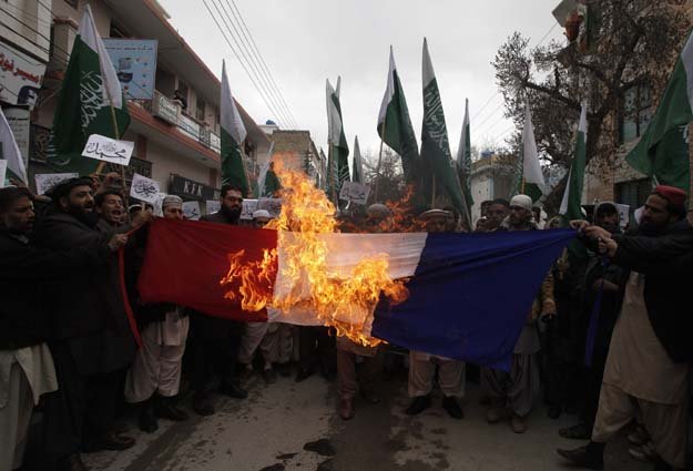 people burn the french flag in a protest against satirical french weekly newspaper charlie hebdo in quetta photo reuters