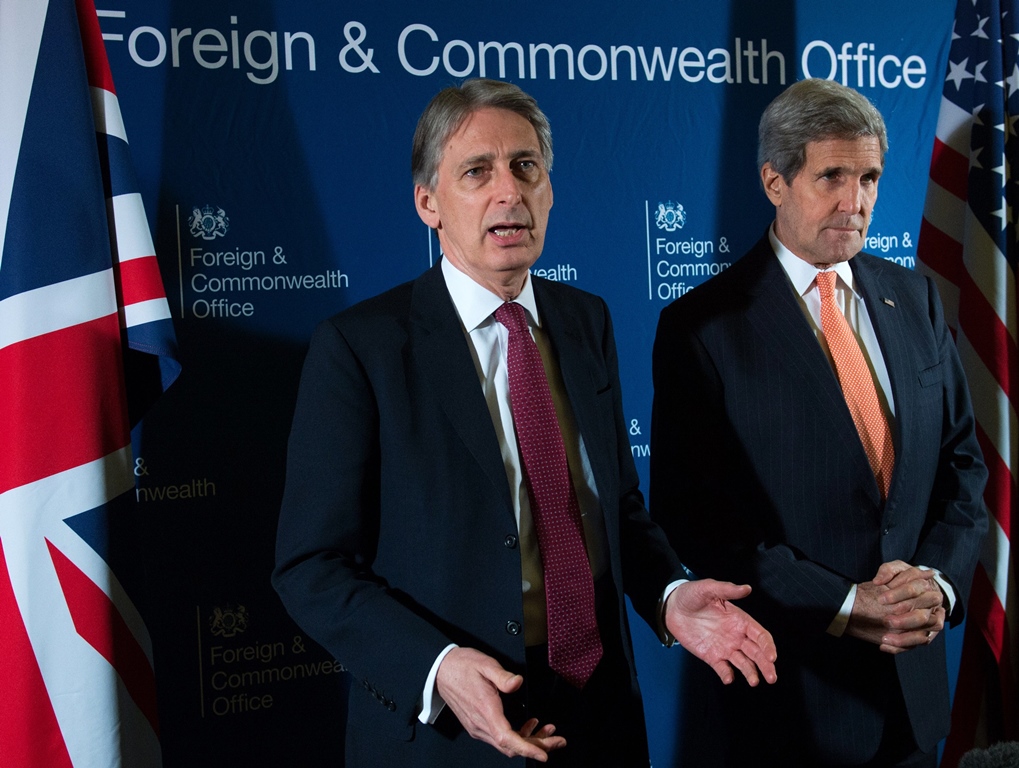 british foreign secretary philip hammond l and us secretary of state john kerry r speak to the media at the start of the meeting with members of an anti islamic state coalition is at lancaster house in london january 22 2015 photo afp