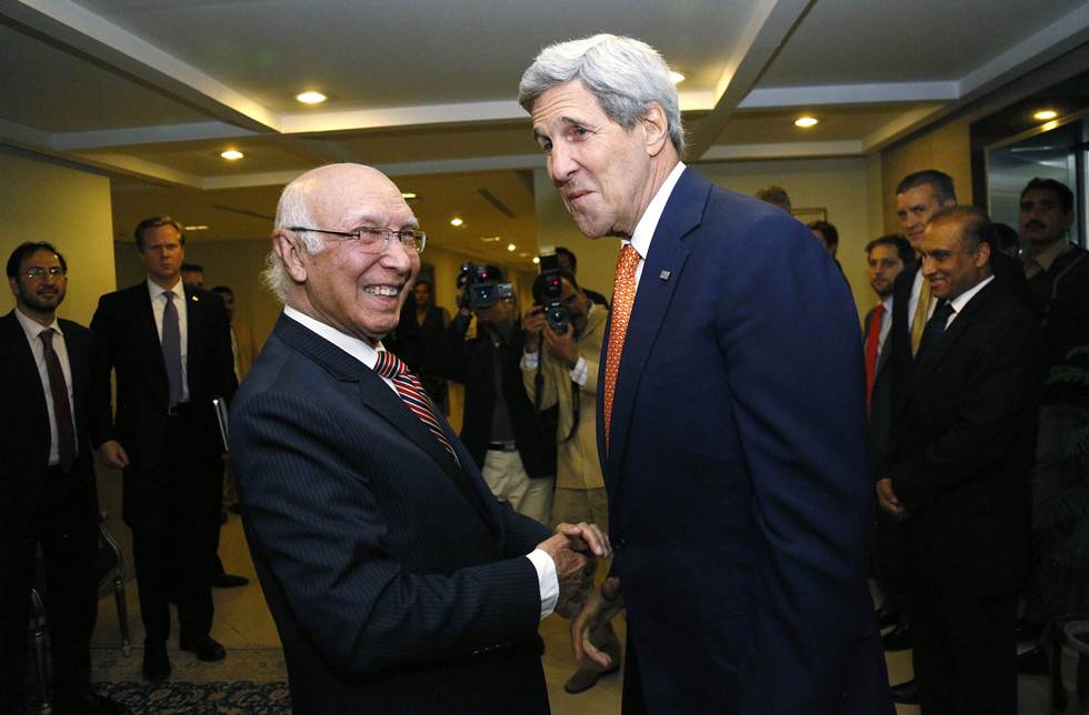 in this file photo us secretary of state john kerry is greeted by national security advisor sartaj aziz l shortly after arriving in islamabad on january 12 2015 photo afp