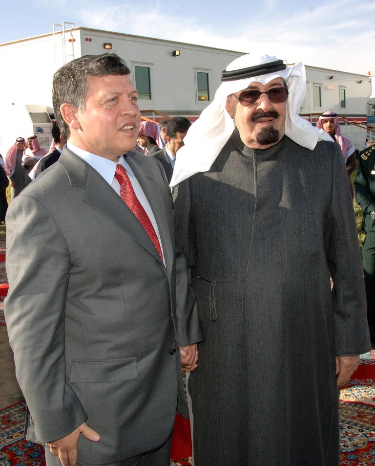 a handout picture released by the official saudi press agency spa on february 19 2009 shows saudi king abdullah bin abdul aziz al saud r welcoming king abdullah ii of jordan in riyadh photo afp