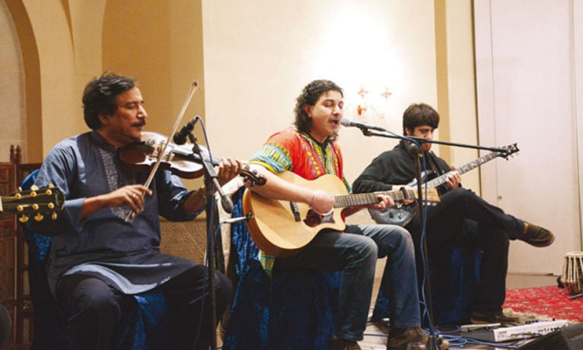 an acoustic guitar slinging azhar took centre stage accompanied by zeeshan mansoor on electric guitar zain ali on bass and guitar raees khan on violin and fazal abbas on the tabla photo huma choudhary an acoustic guitar slinging azhar took centre stage accompanied by zeeshan mansoor on electric guitar zain ali on bass and guitar raees khan on violin and fazal abbas on the tabla photo huma choudhary