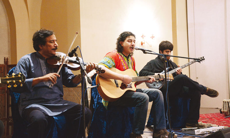 an acoustic guitar slinging azhar took centre stage accompanied by zeeshan mansoor on electric guitar zain ali on bass and guitar raees khan on violin and fazal abbas on the tabla photo huma choudhary
