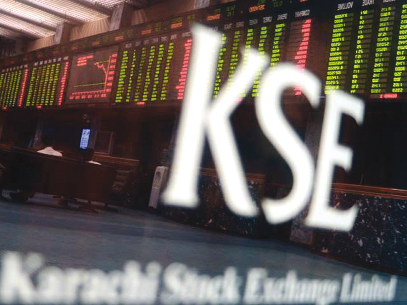 standing beside kse deputy managing director haroon askari sindh modaraba ceo javed iqbal hit the gong that formally kicked off the trading photo afp