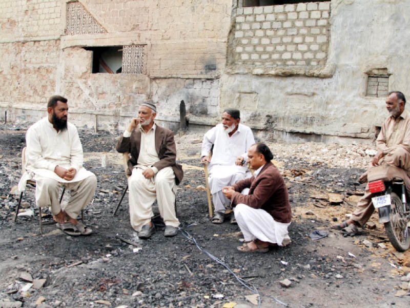 the timber market traders gather at the spot where their shops once were hoping the government will kick off the restoration work soon photo aysha saleem express