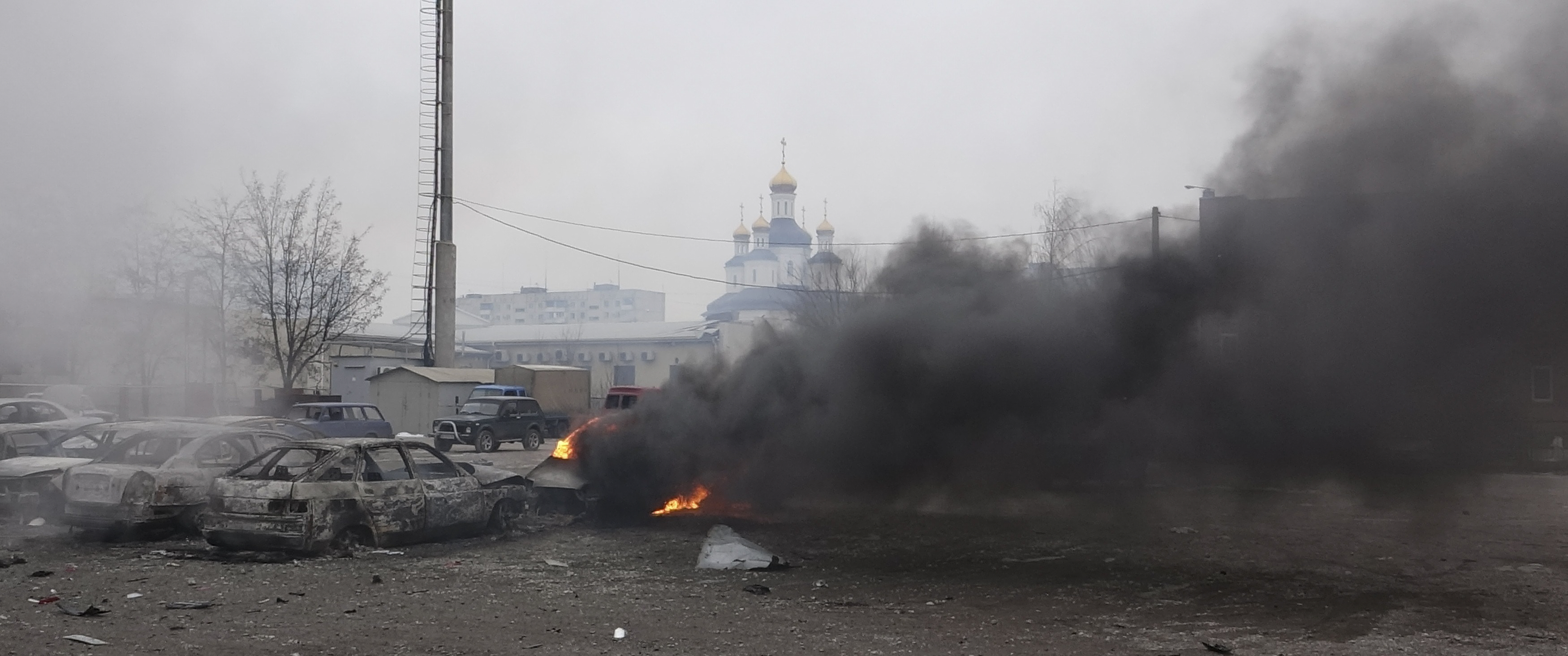 a car burns on the street after a shelling by pro russian rebels of a residential sector of mariupol eastern ukraine january 24 2015 photo reuters